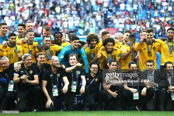 Belgium players pose for a photo after receiving their third place medals during the 2018 FIFA World Cup Russia 3rd Place Playoff match between...
