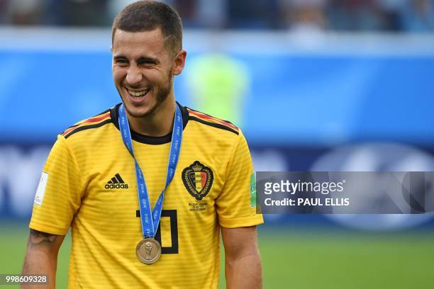 Belgium's forward Eden Hazard smiles after receiving his bronze medal following their Russia 2018 World Cup play-off for third place football match...