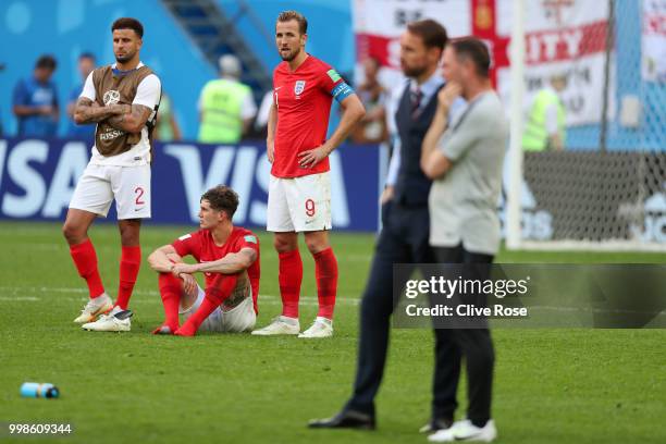 Kyle Walker, John Stones, and Harry Kane of England look dejected as Belgium recieve their third place medals during the 2018 FIFA World Cup Russia...