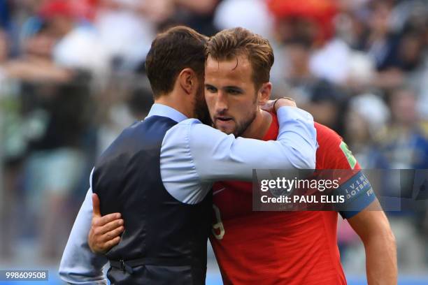 England's coach Gareth Southgate hugs England's forward Harry Kane after losing their Russia 2018 World Cup play-off for third place football match...