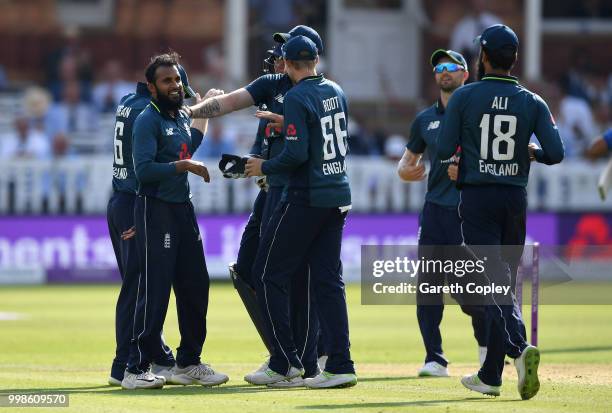 Adil Rashid of England celebrates with teammates after dismissing Suresh Raina of India during the 2nd ODI Royal London One-Day match between England...