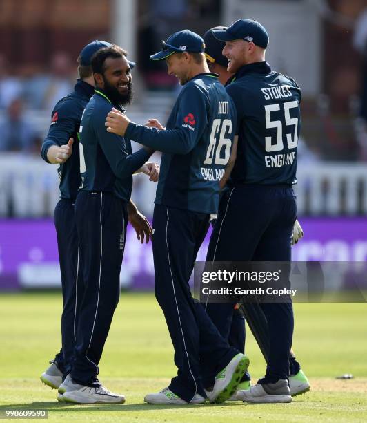 Adil Rashid of England celebrates with teammates after dismissing Suresh Raina of India during the 2nd ODI Royal London One-Day match between England...