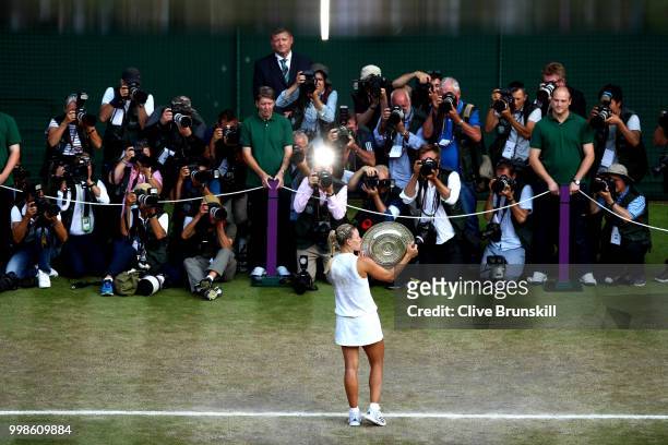 Angelique Kerber of Germany kisses the Venus Rosewater Dish as she poses for photographs after defeating Serena Williams of The United States in the...