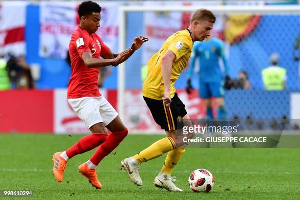 Belgium's midfielder Kevin De Bruyne is chased by England's midfielder Jesse Lingard during their Russia 2018 World Cup play-off for third place...