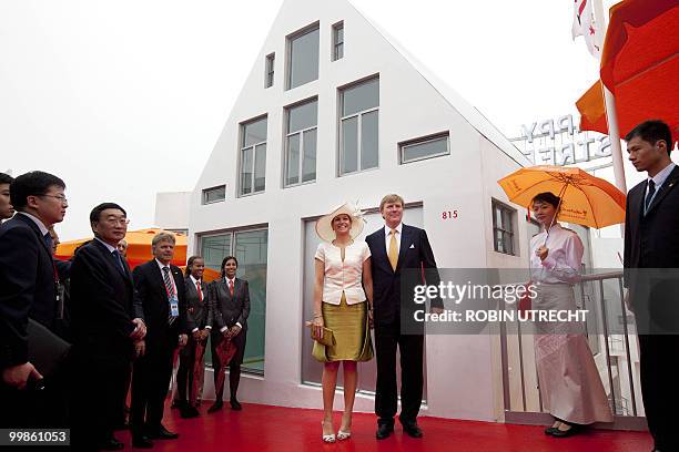 Dutch crown prince Willem-Alexander and his wife princess Maxima pose as they visit the World Expo 2010 in Shanghai, on the National Day of the...
