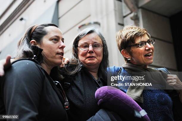 Cindy Hickey , Nora Shourd and Laura Fattal , mothers of the US hikers being held in Iran, speak to the media before leaving to the airport May 18,...