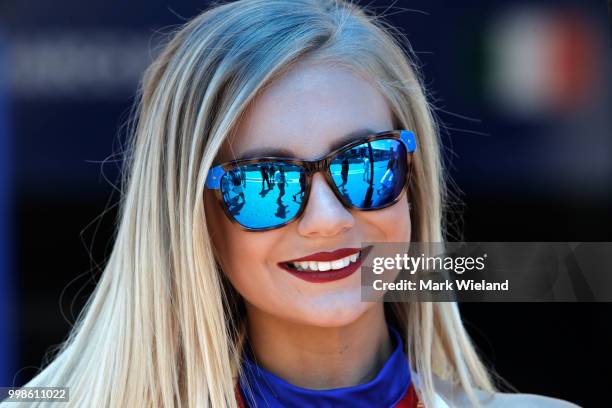 Grid girl looks on from the pits in qualifying during the MotoGP of Germany at Sachsenring Circuit on July 14, 2018 in Hohenstein-Ernstthal, Germany.