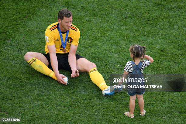 Belgium's defender Jan Vertonghen talks to his daughter, Leyla, after their Russia 2018 World Cup play-off for third place football match between...