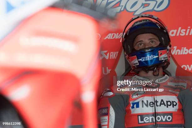 Andrea Dovizioso of Italy and Ducati Team looks on in box during the qualifying practice during the MotoGp of Germany - Qualifying at Sachsenring...