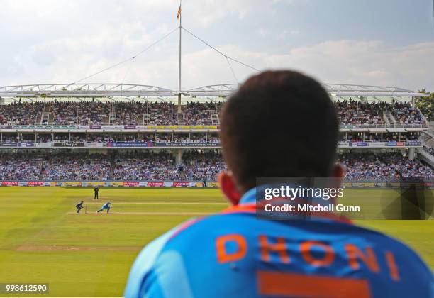 Fan wearing an MS Dhoni shirt watches on as MS Dhoni of India bats during the 2nd Royal London One day International match between England and India...