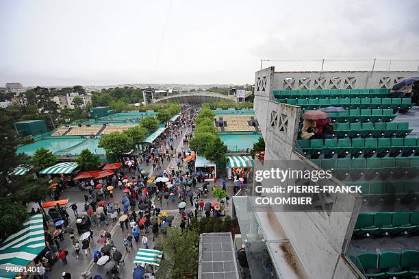 Visitors wait in the tribune of the Philippe Chatrier stadium at Roland Garros, in Paris, on May 26 as the game of the French Tennis Open first round...