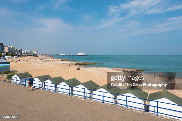 a view of the beach, promenade and pier, eastbourne - eastbourne pier photos et images de collection