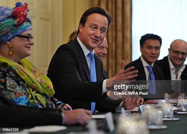British Prime Minister, David Cameron, gestures as he chairs 'The Big Society' meeting in the cabinet room of 10 Downing Street on May 18, 2010 in...