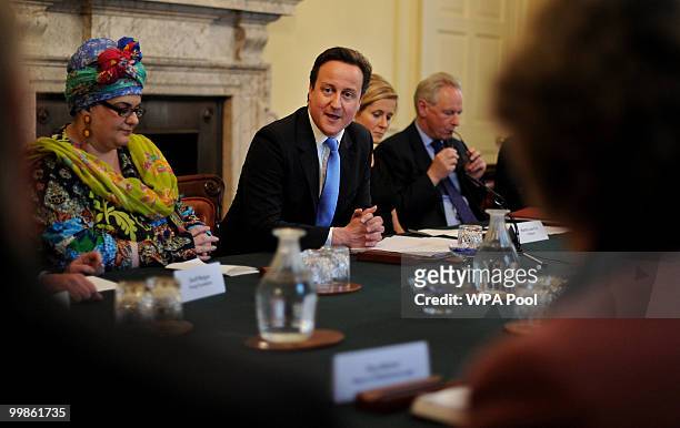 Founder of Kids Co, Camila Batmanghelidjh , sits beside British Prime Minister, David Cameron, as he chairs 'The Big Society' meeting in the cabinet...