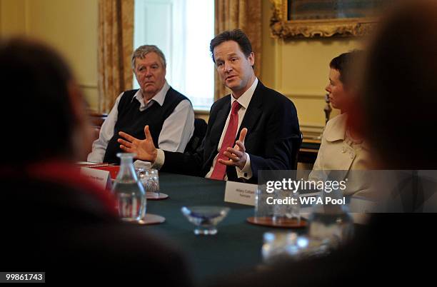 British Deputy Prime Minister, Nick Clegg , gestures during 'The Big Society' meeting in the cabinet room of 10 Downing Street on May 18, 2010 in...