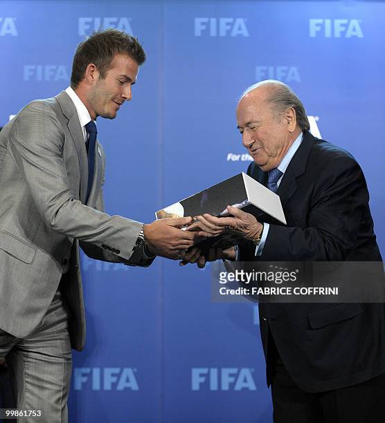 President Sepp Blatter receives from David Beckham the England 2018 and 2022 World Cup bid book during for an official handover ceremony at FIFA's...