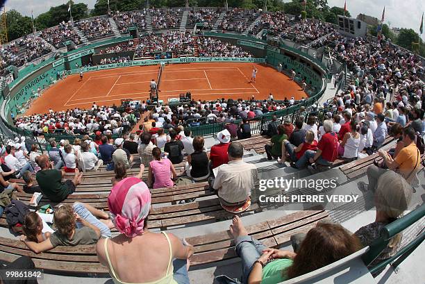 French player Julien Benneteau serves to Colombian player Alejandro Falla during the second round of the French Tennis Open, at Roland Garros, in...