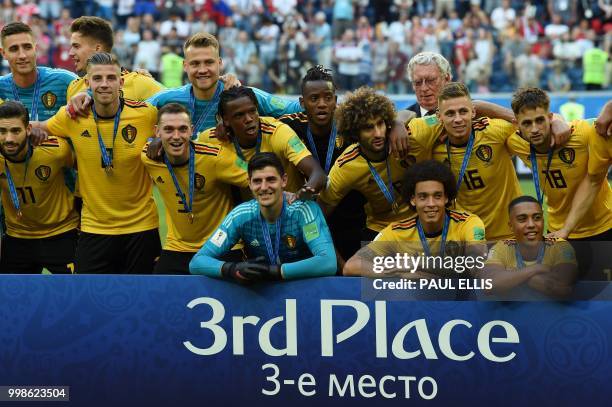 Belgium's team pose with their medals after winning their Russia 2018 World Cup play-off for third place football match between Belgium and England...