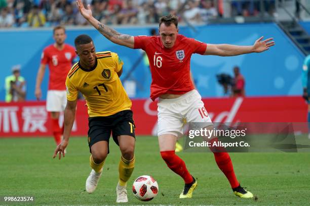 Youri Tielemans of Belgium competes for the ball with Phil Jones of England during the 2018 FIFA World Cup Russia 3rd Place Playoff match between...