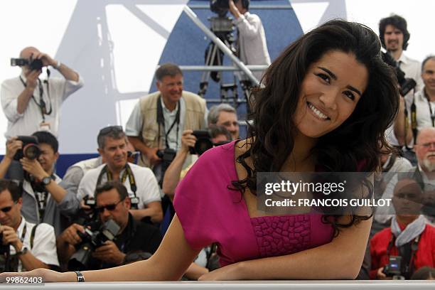 French actress Sabrina Ouazani poses during the photocall of "Des Hommes et des Dieux" presented in competition at the 63rd Cannes Film Festival on...