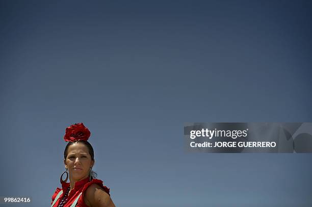 Pilgrim makes her way to the shrine of El Rocio in Donana national park during the annual El Rocio pilgrimage, on May 18, 2010 in Sanlucar de...