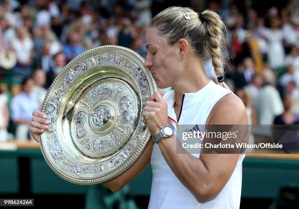 Womens Singles Final - Serena Williams v Angelique Kerber - Angelique Kerber kisses the trophy at All England Lawn Tennis and Croquet Club on July...