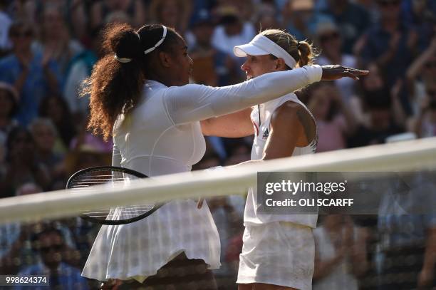 Germany's Angelique Kerber embraces US player Serena Williams after winning their women's singles final match on the twelfth day of the 2018...