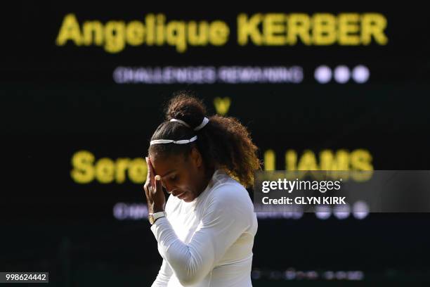 Player Serena Williams reacts after losing a point against Germany's Angelique Kerber during their women's singles final match on the twelfth day of...