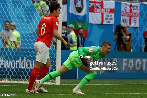 Jordan Pickford of England makes a save while Harry Maguire looks on during the 2018 FIFA World Cup Russia 3rd Place Playoff match between Belgium...