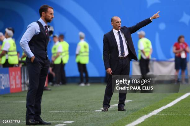 Belgium's coach Roberto Martinez gestures beside England's coach Gareth Southgate during their Russia 2018 World Cup play-off for third place...