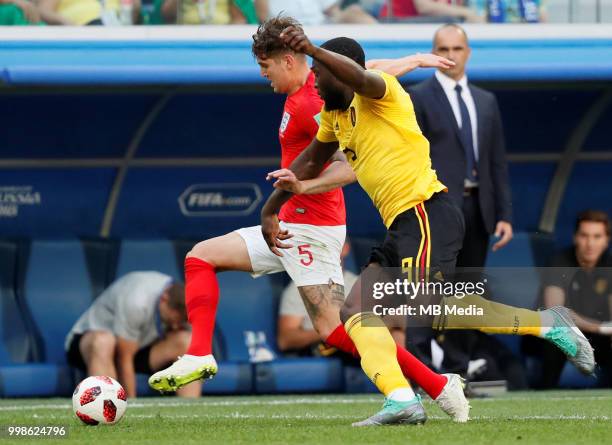 John Stones of England and Romelu Lukaku of Belgium vie for the ball during the 2018 FIFA World Cup Russia 3rd Place Playoff match between Belgium...