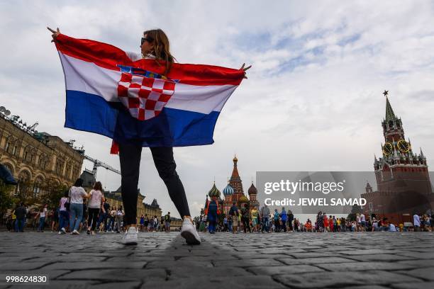 Croatia fan poses at the Red Square in Moscow on July 14, 2018 on the eve of the Russia 2018 World Cup final football match between France and...