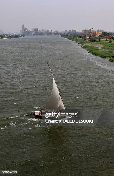 Local sailboat, known as faluka, sails in the River Nile on the outskirts of Cairo on May 18, 2010. Four African countries signed on May 14 a new...