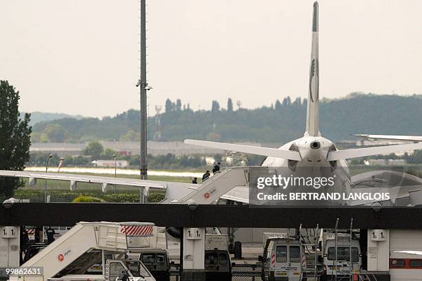 Iranian agent Ali Vakili Rad escorted by policemen climbs aboard an Iranian Air plane which will carry him back home to Iran at the Orly airport,...