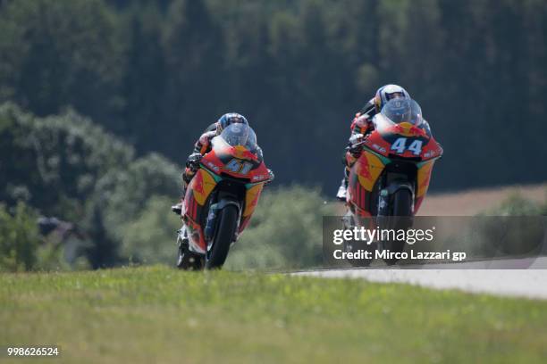 Miguel Oliveira of Portugal and Red Bull KTM Ajo leads Brad Binder of South Africa and Red Bull KTM Ajo during the qualifying practice during the...