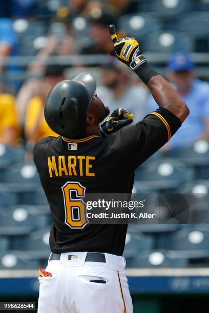 Starling Marte of the Pittsburgh Pirates reacts after hitting a home run in the first inning during game one of a doubleheader against the Milwaukee...