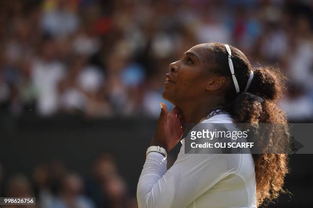 Player Serena Williams reacts after losing a point against against Germany's Angelique Kerber during their women's singles final match on the twelfth...