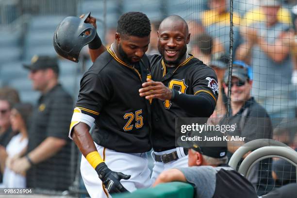 Gregory Polanco of the Pittsburgh Pirates celebrates after hitting a home run in the first inning with Gregory Polanco during game one of a...