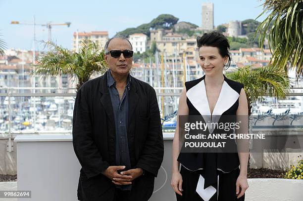 Iranian director Abbas Kiarostami and French actress Juliette Binoche pose during the photocall of "Copie Conforme presented in competition at the...