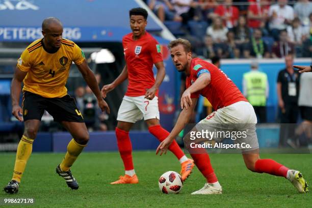 Harry Kane of England evades Vincent Kompany of Belgium during the 2018 FIFA World Cup Russia 3rd Place Playoff match between Belgium and England at...