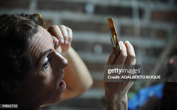 Cuban transvestite Roxi Rojo gets ready for a transvestite show, on May 17, 2010 in Santa Clara city -300 km from Havana. This transvestite show, the...