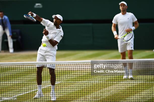 Raven Klaasen of South Africa and Michael Venus of New Zealand return against Mike Bryan and Jack Sock of The United States during the Men's Doubles...