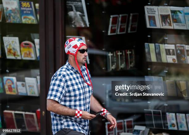 Man dressed in the colors of the Croatian coat of arms passes by a square on July 14, 2018 in Zagreb, Croatia. This is the first time Croatia has...