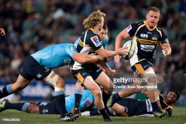 Brumbies player Joe Powell gets the pass away to Brumbies player Nick Mayhew at week 19 of the Super Rugby between The Waratahs and Brumbies at...