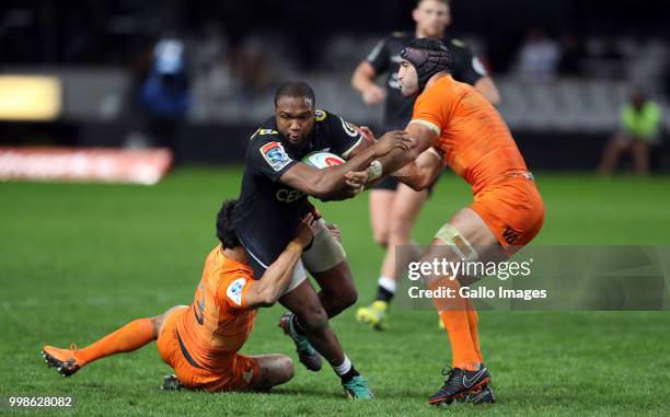 Matias Moroni and Juan Manuel Leguizamon of the Jaguares tackling Lukhanyo Am of the Cell C Sharks during the Super Rugby match between Cell C Sharks...