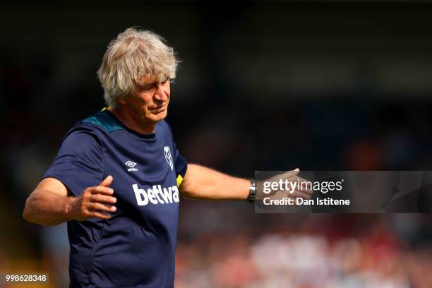 West Ham manager Manuel Pellegrini reacts during the pre-season friendly match between Wycombe Wanderers and West Ham United at Adams Park on July...