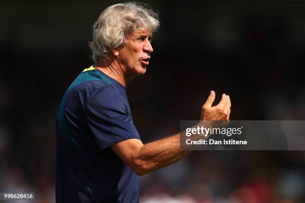 West Ham manager Manuel Pellegrini issues instructions to his players during the pre-season friendly match between Wycombe Wanderers and West Ham...