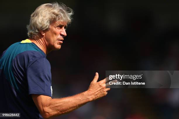 West Ham manager Manuel Pellegrini issues instructions to his players during the pre-season friendly match between Wycombe Wanderers and West Ham...