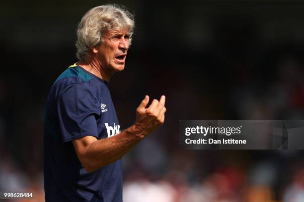 West Ham manager Manuel Pellegrini issues instructions to his players during the pre-season friendly match between Wycombe Wanderers and West Ham...