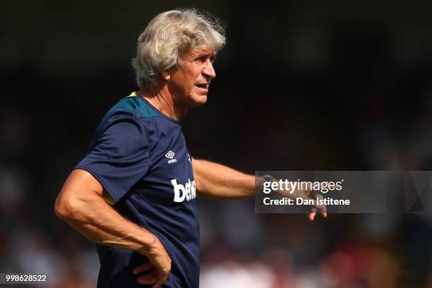 West Ham manager Manuel Pellegrini issues instructions to his players during the pre-season friendly match between Wycombe Wanderers and West Ham...